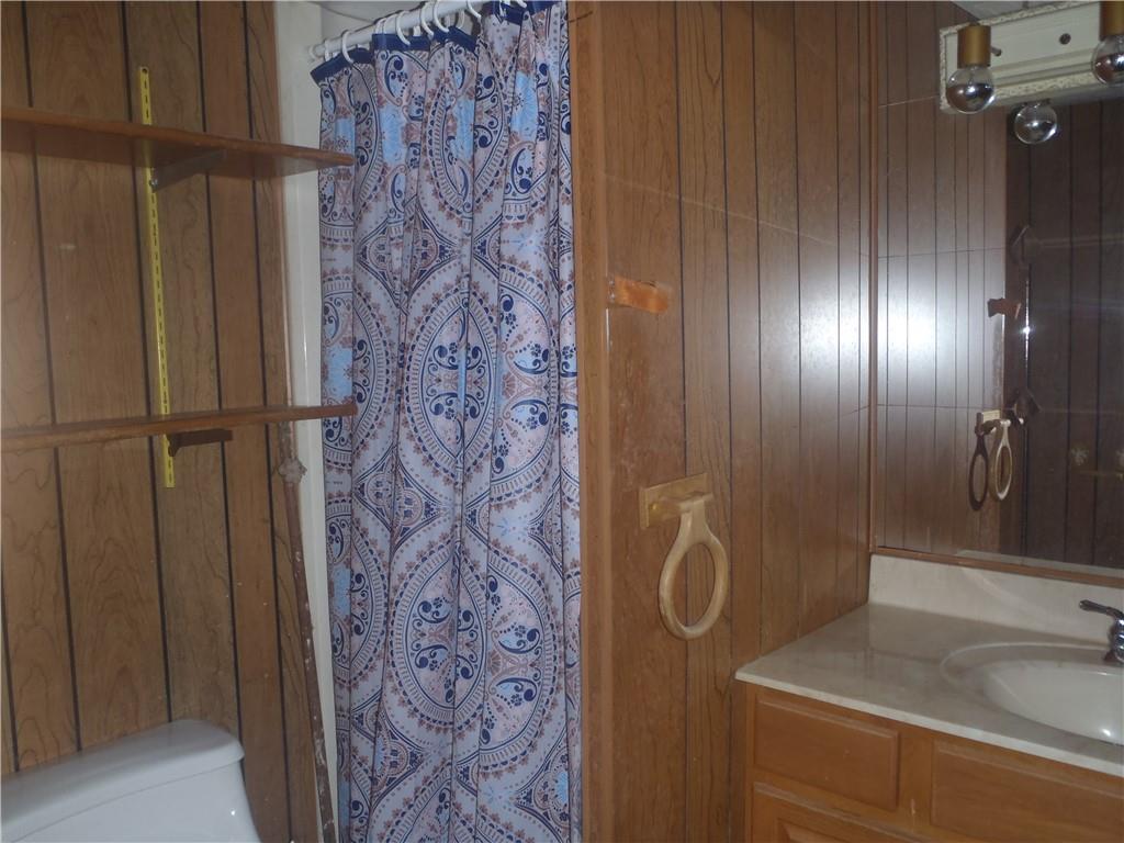 2614 Old Pittsburgh Road New Castle, PA 16101 - Photo 9 of 16 a bathroom with a sink and a mirror