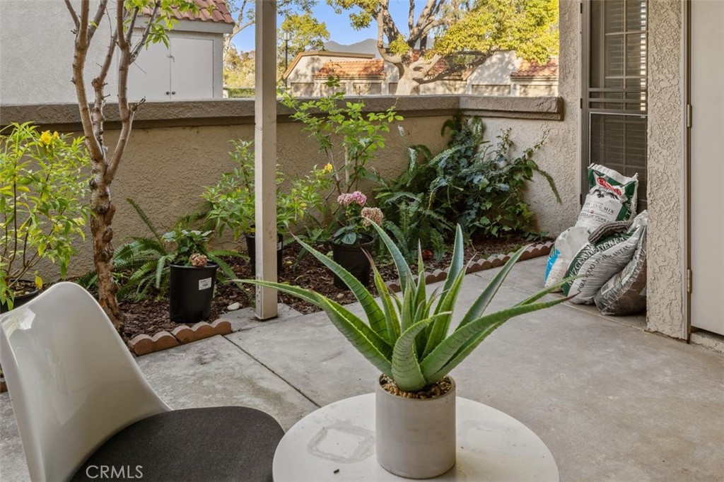 28101 Montecito, Unit 15 Laguna Niguel, CA 92677 - Photo 27 of 44 a potted plant sitting in front of a house