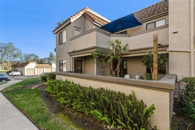 front view of a house with a garden