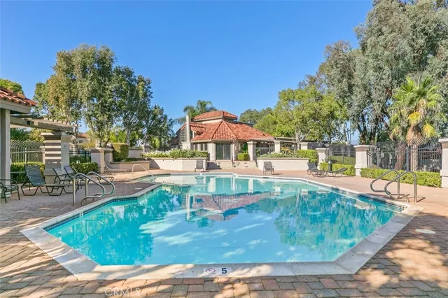 swimming pool view with a outdoor seating