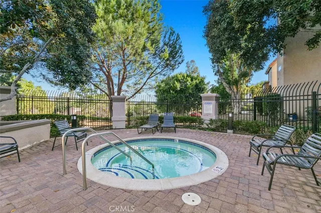 a house view with a seating space and a garden