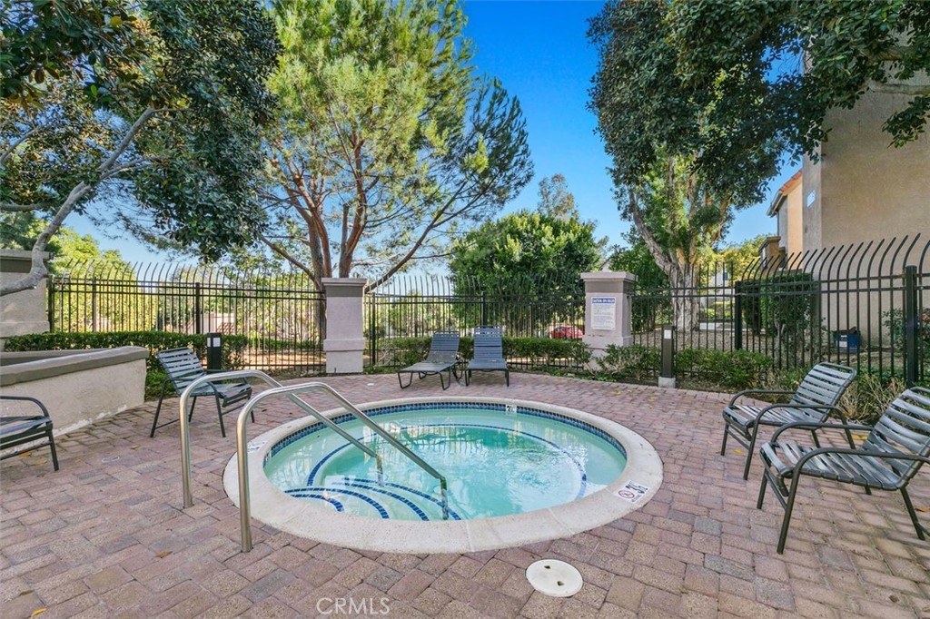 28101 Montecito, Unit 15 Laguna Niguel, CA 92677 - Photo 35 of 44 a house view with a seating space and a garden