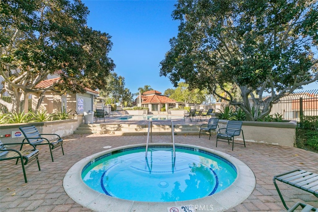 28101 Montecito, Unit 15 Laguna Niguel, CA 92677 - Photo 36 of 44 a view of a swimming pool with outdoor seating