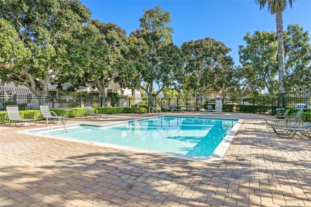 28101 Montecito, Unit 15 Laguna Niguel, CA 92677 - Photo 37 of 44 a view of a swimming pool with a yard