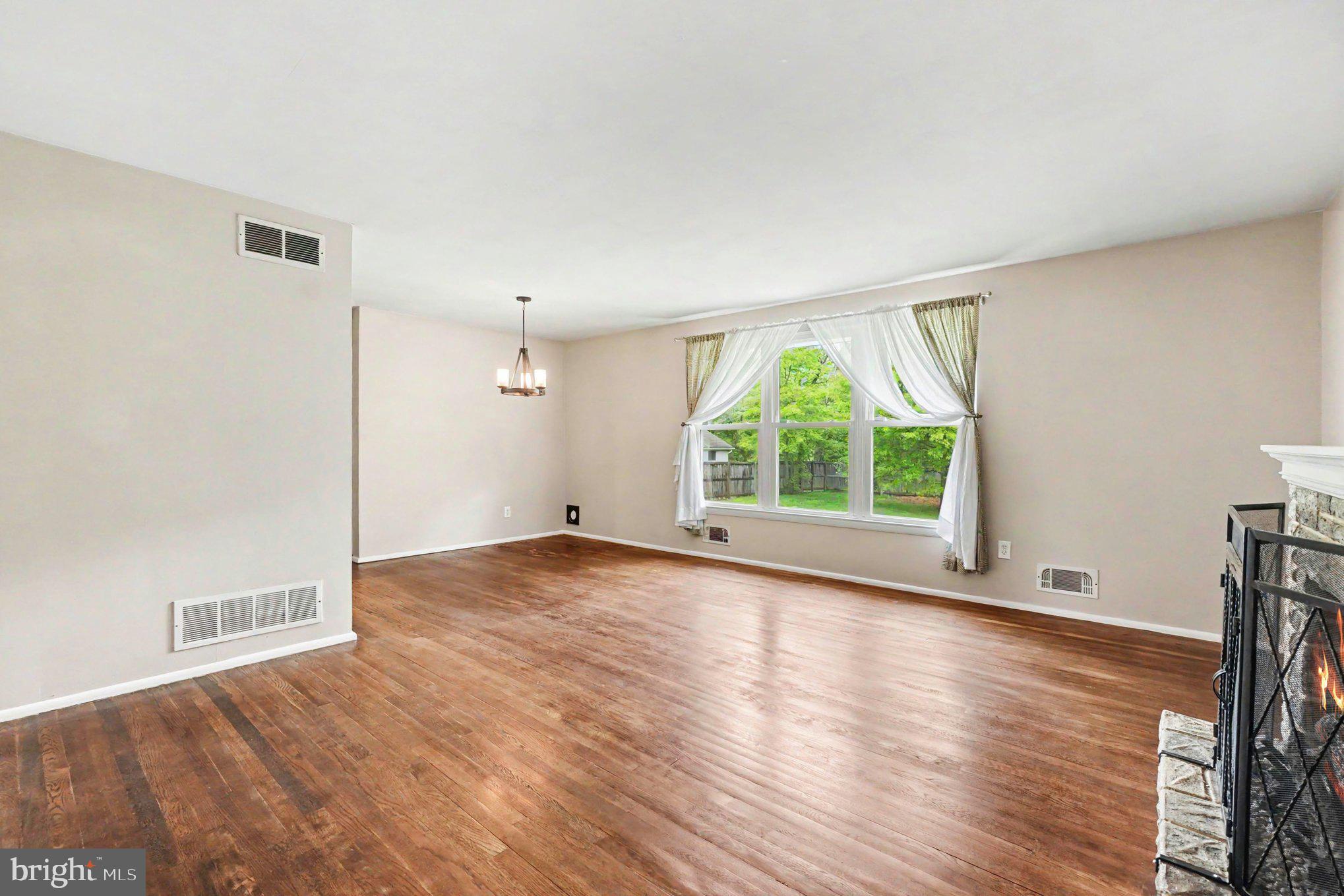 201 Mountain Road Fallston, MD 21047 - Photo 10 of 35 a view of an empty room with wooden floor and a window
