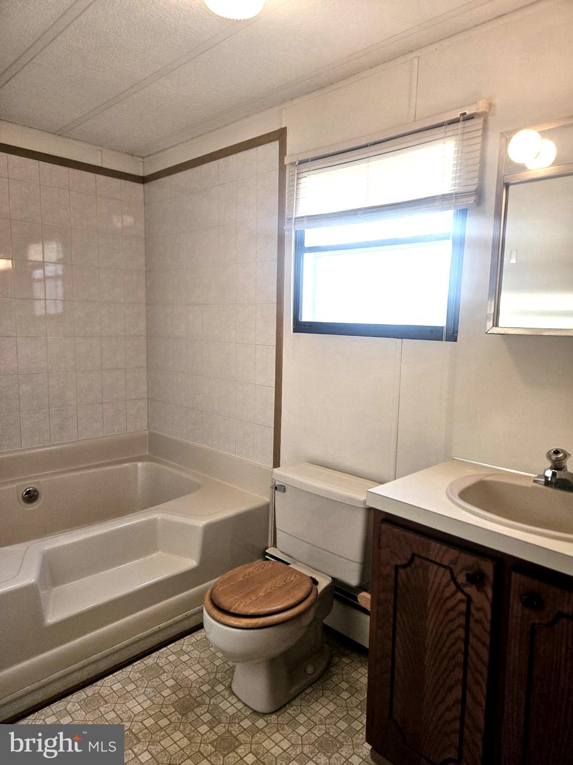 568 Miles Standish Lane Buena, NJ 08310 - Photo 12 of 19 a bathroom with a sink a toilet and shower