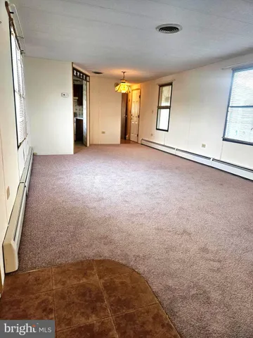 a kitchen with stainless steel appliances a stove a sink and a refrigerator