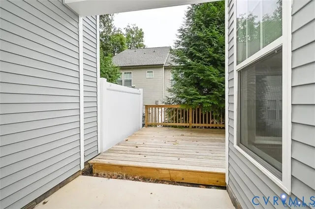 a view of an empty room with windows