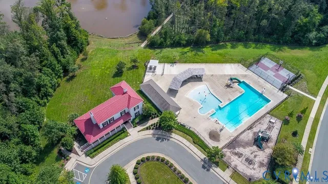 a view of a swimming pool with a lounge chairs