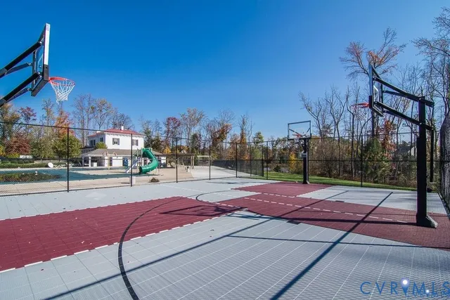 a view of a house with a wooden deck and a park