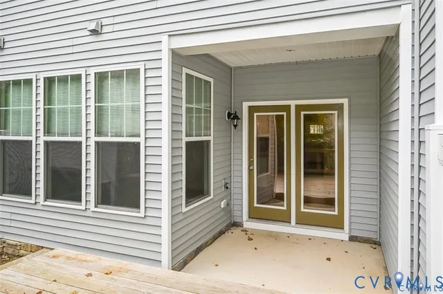 a view of a balcony with a floor to ceiling window and wooden floor