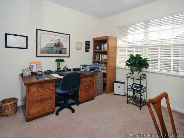 134 Southwest Walking Path Stuart, FL 34997 - Photo 18 of 25 Other. Guest Bedroom, ceiling fan, upgraded carpeting, blinds, large closet