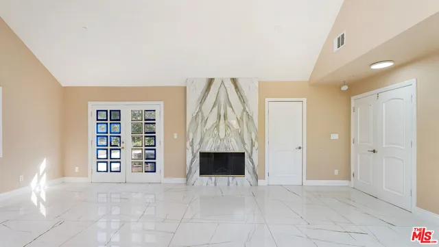 a view of workspace with window and fireplace