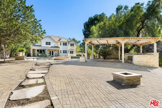 a view of a house with basketball court