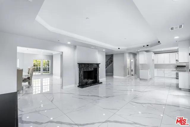 a lobby with furniture and a fireplace