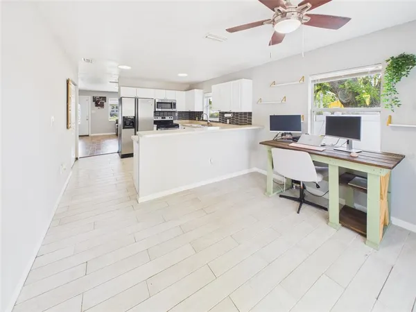 a view of kitchen with furniture and window