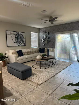 a living room with furniture and a rug