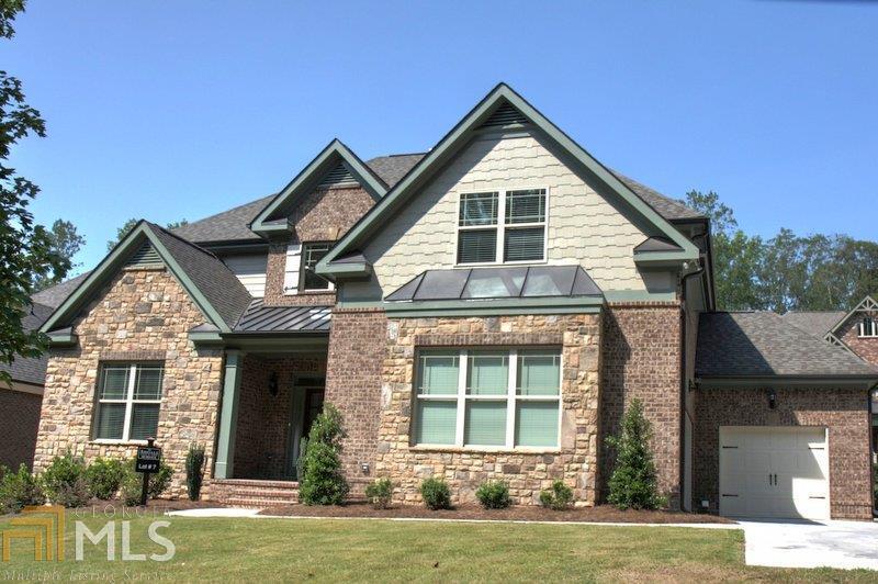 1521 Murdock Road, Unit 7 Marietta, GA 30062 - Photo 1 of 1 Our Beautiful Trent Elite Plan - 3 Sided Brick -3 Car Garage - A Favorite for those looking for a Master on the Main!