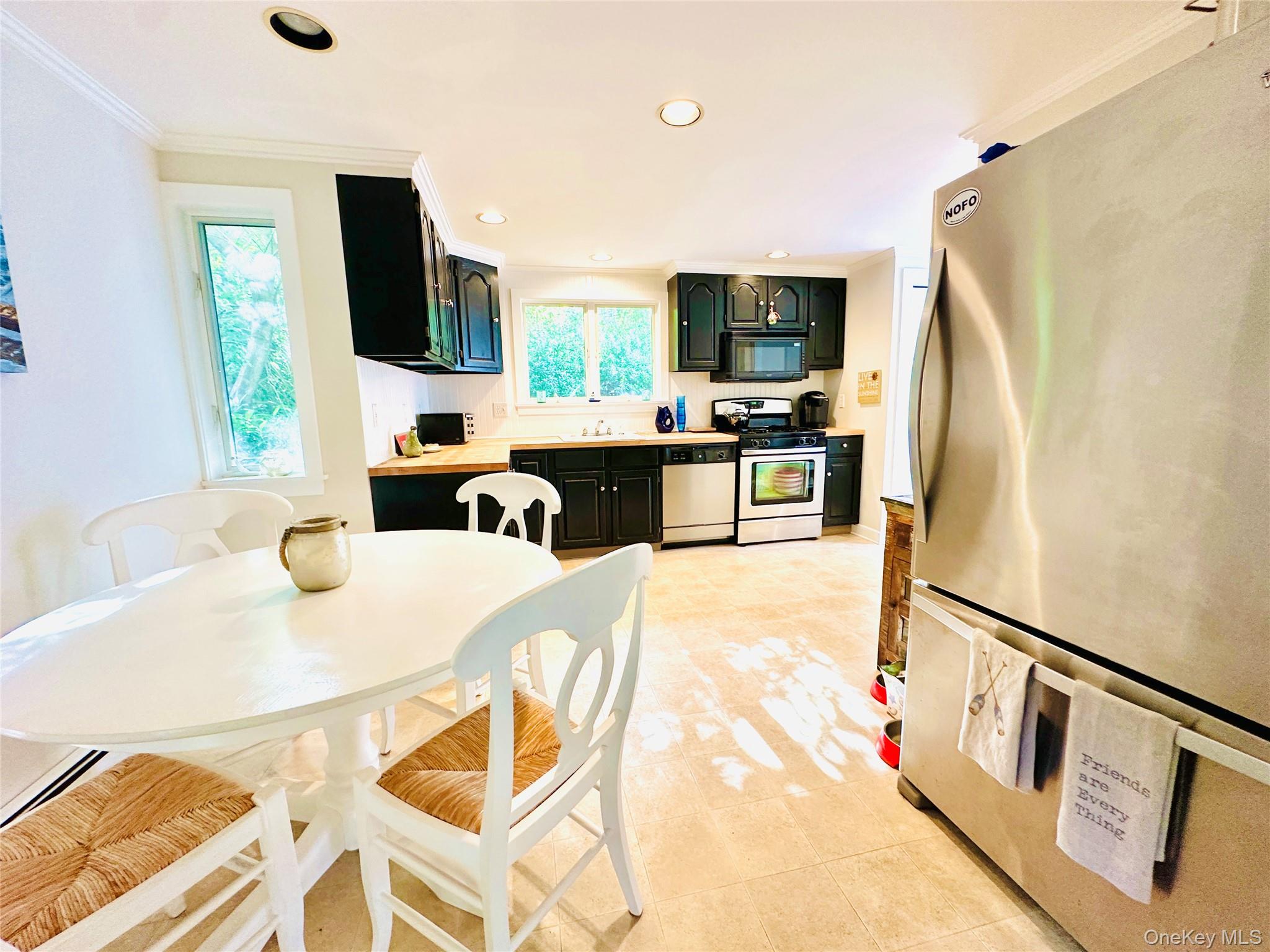 150 Hobart Road Southold, NY 11971 - Photo 5 of 18 a living room with furniture a flat screen tv and a window