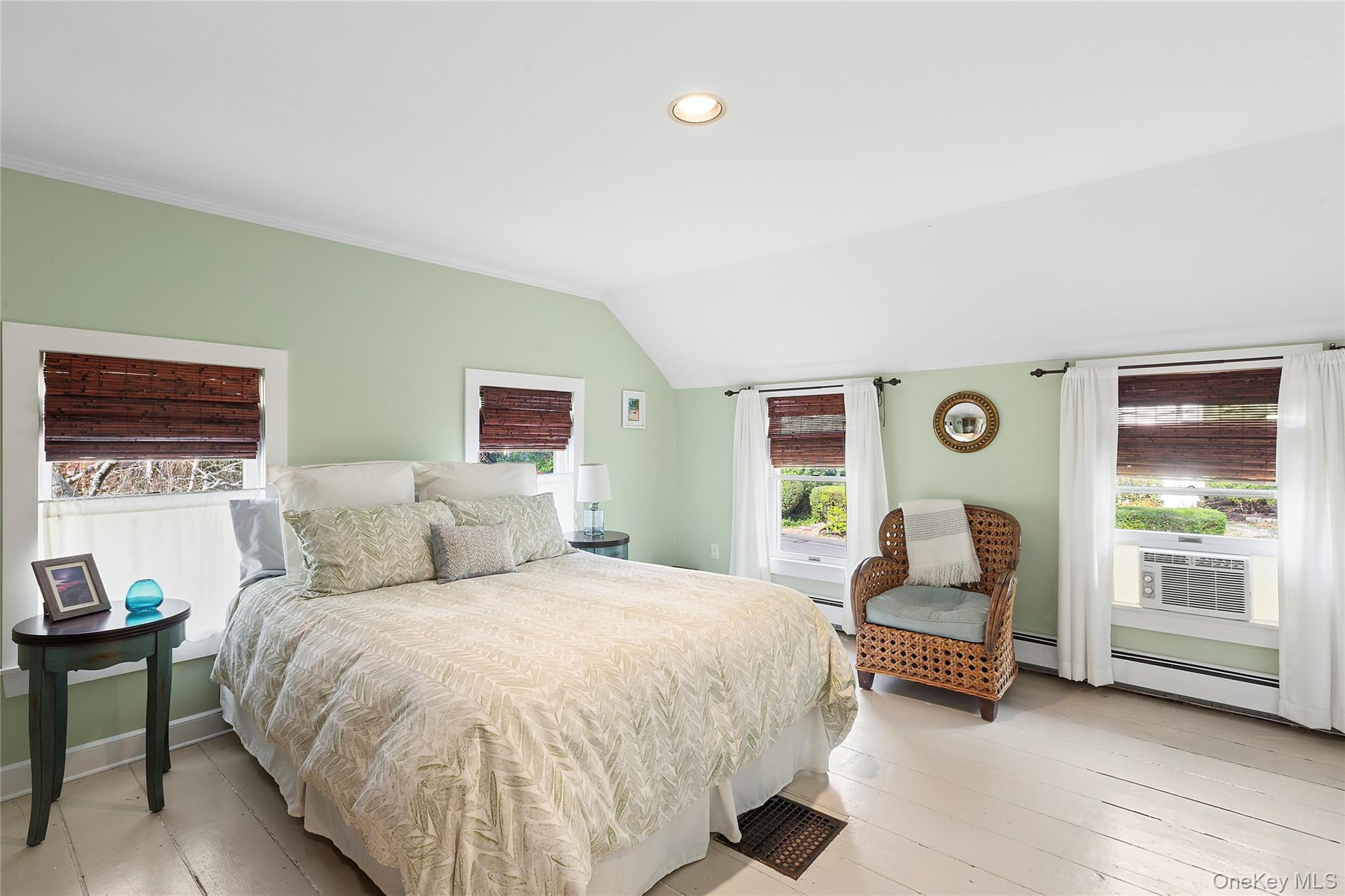 150 Hobart Road Southold, NY 11971 - Photo 6 of 18 a bed room with a bed and a chair