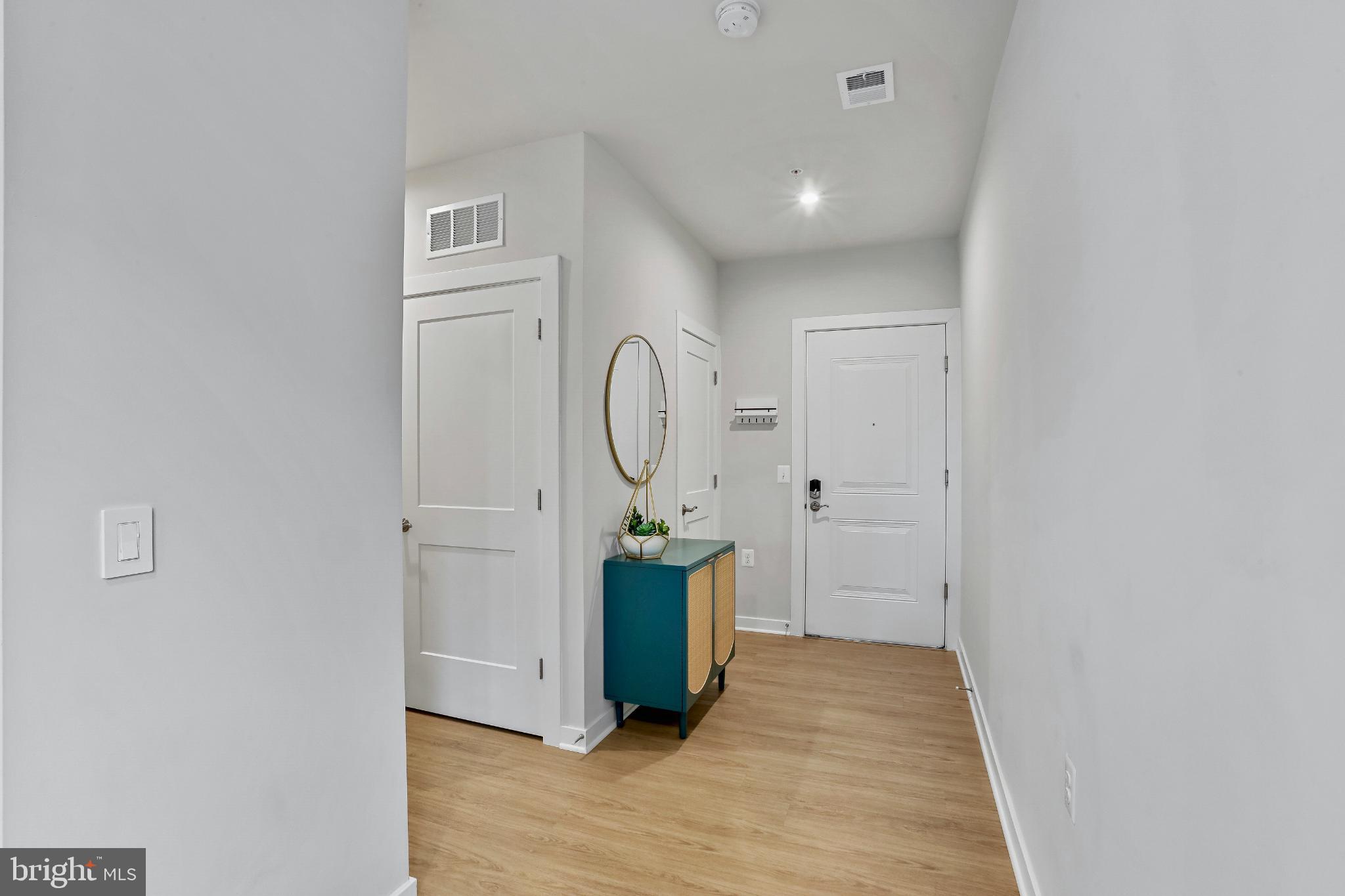 1675 Bandit Loop, Unit 201B Reston, VA 20190 - Photo 12 of 27 a view of a hallway with wooden floor