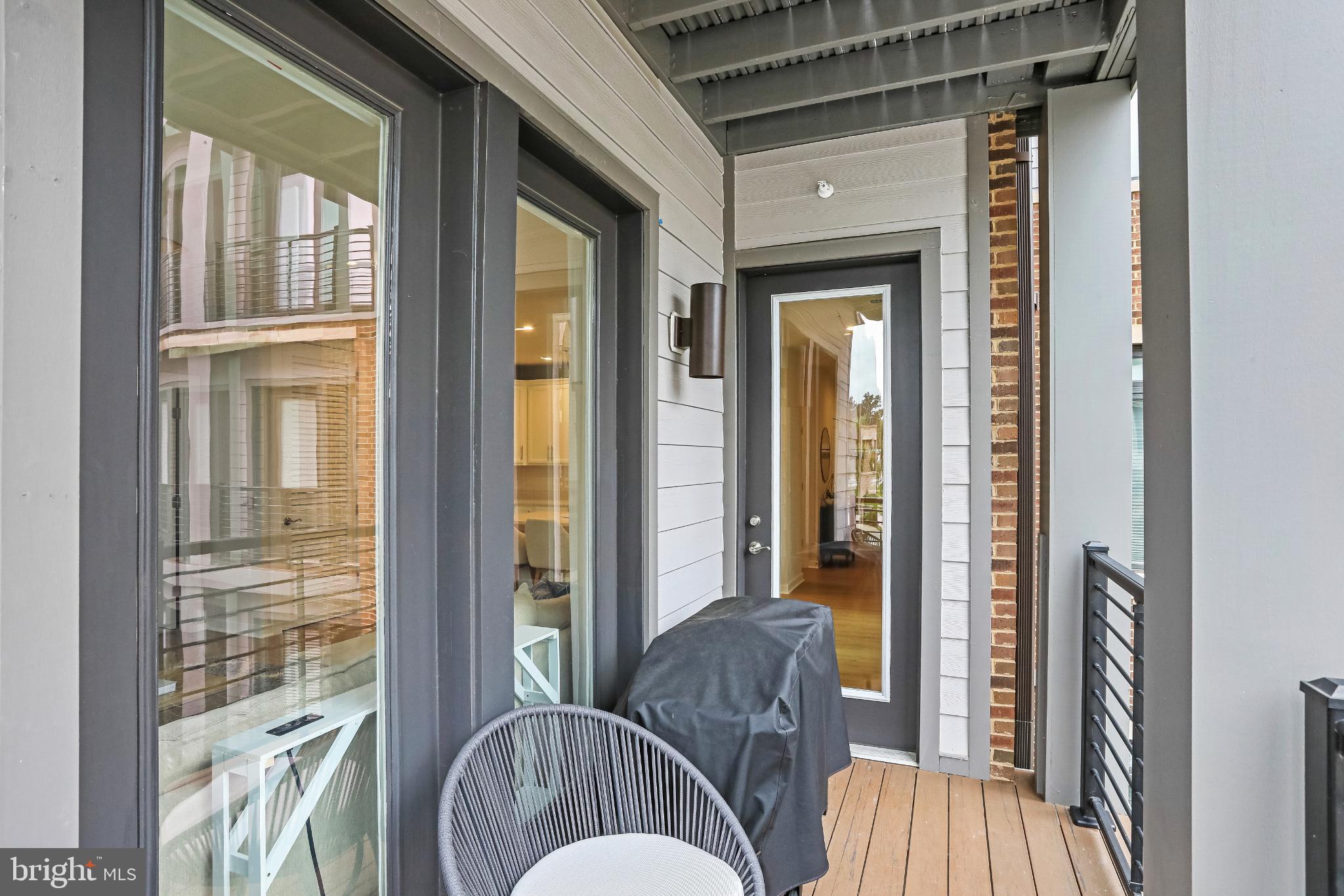1675 Bandit Loop, Unit 201B Reston, VA 20190 - Photo 18 of 27 a living room with furniture and a window