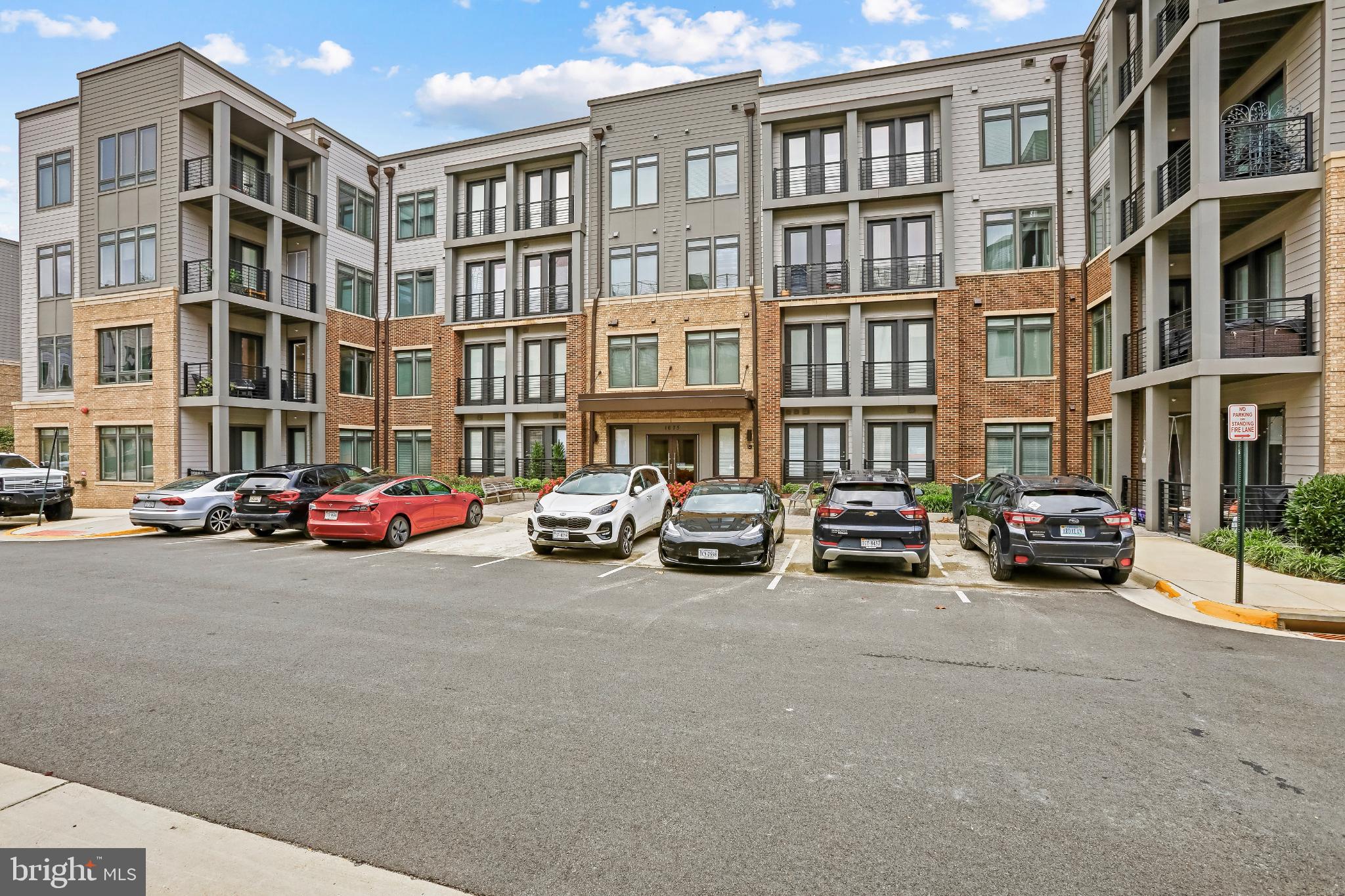 1675 Bandit Loop, Unit 201B Reston, VA 20190 - Photo 22 of 27 a car parked in front of a building