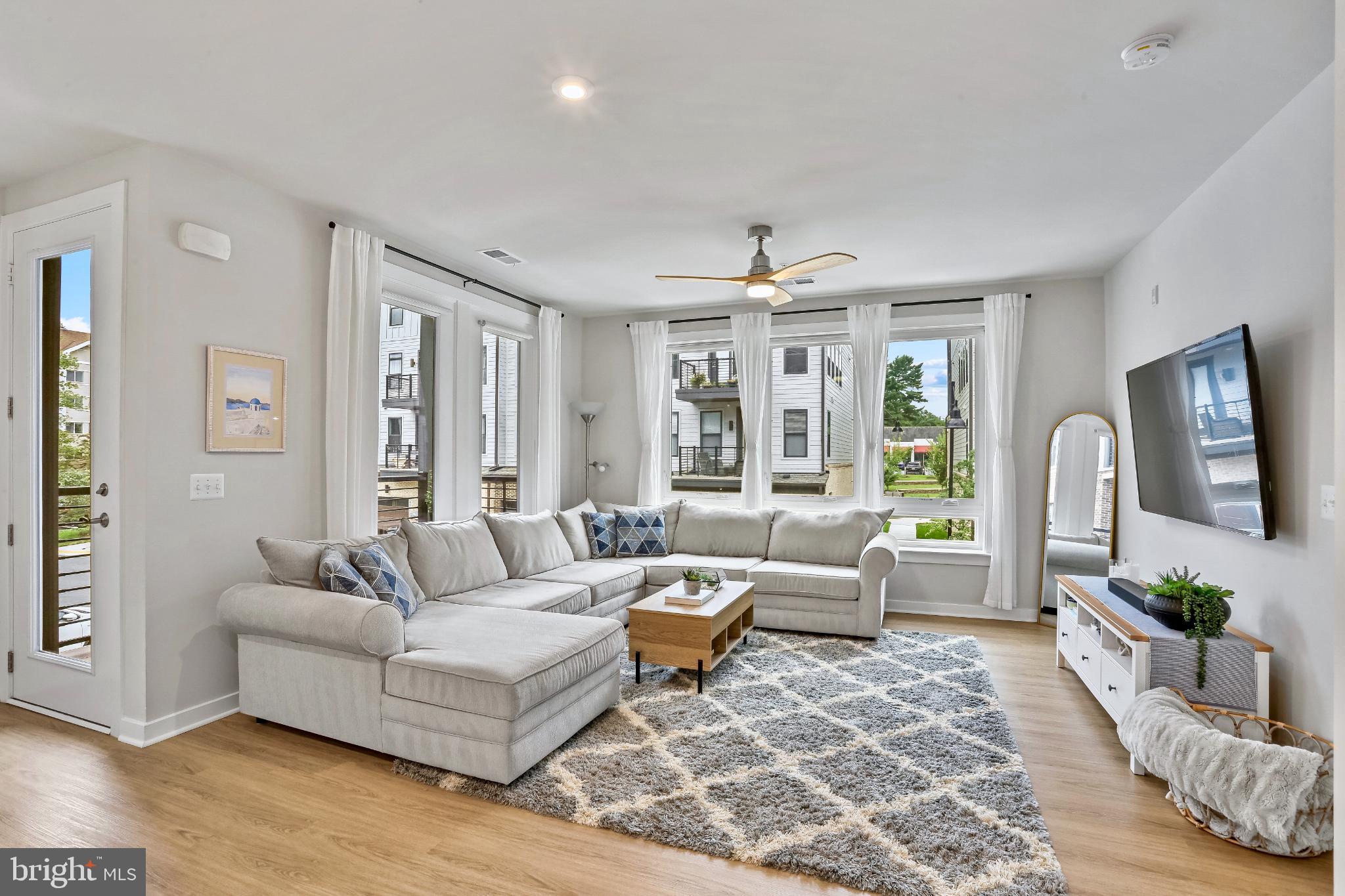 1675 Bandit Loop, Unit 201B Reston, VA 20190 - Photo 7 of 27 a living room with furniture and wooden floor