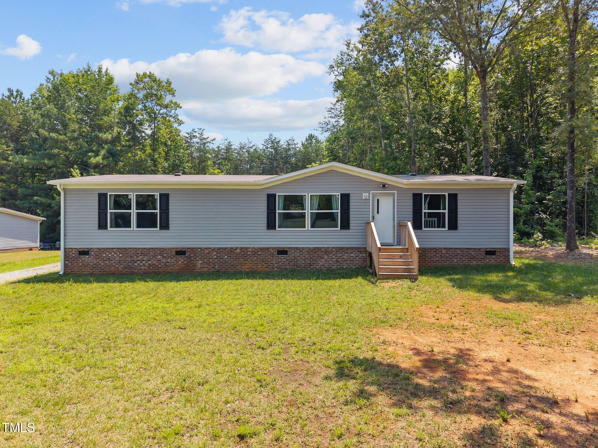 1739 Hurdle Mills Road Roxboro, NC 27573 - Photo 1 of 37 1-web-or-mls-DJI_20250708122514_0596_D
