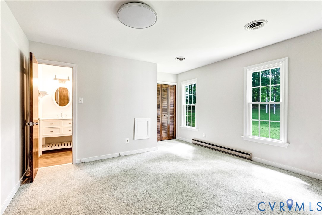 10478 Gould Hill Road Hanover, VA 23069 - Photo 29 of 63 First floor primary bedroom. Two closets. Freshl