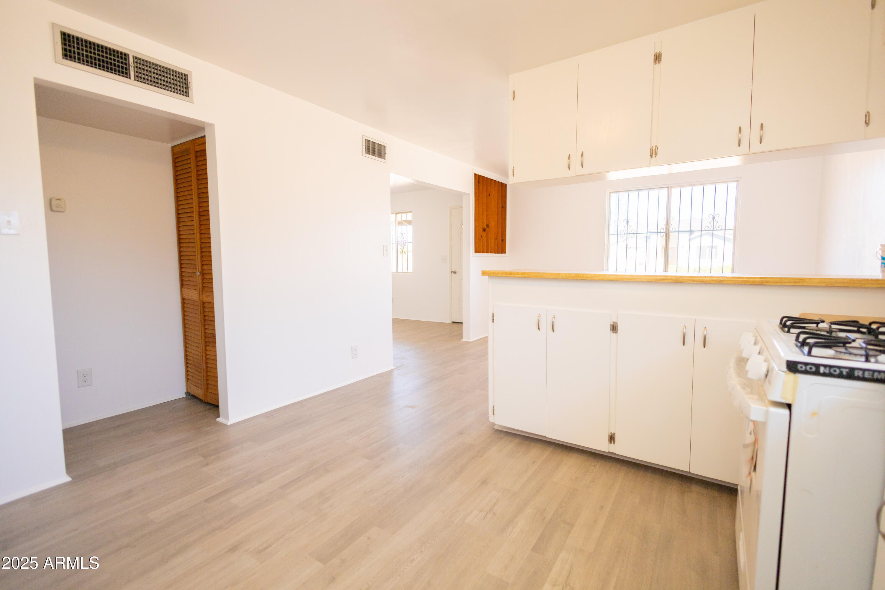 1301 East 14th Street Douglas, AZ 85607 - Photo 25 of 45 a view of a kitchen with wooden floor and electronic appliances