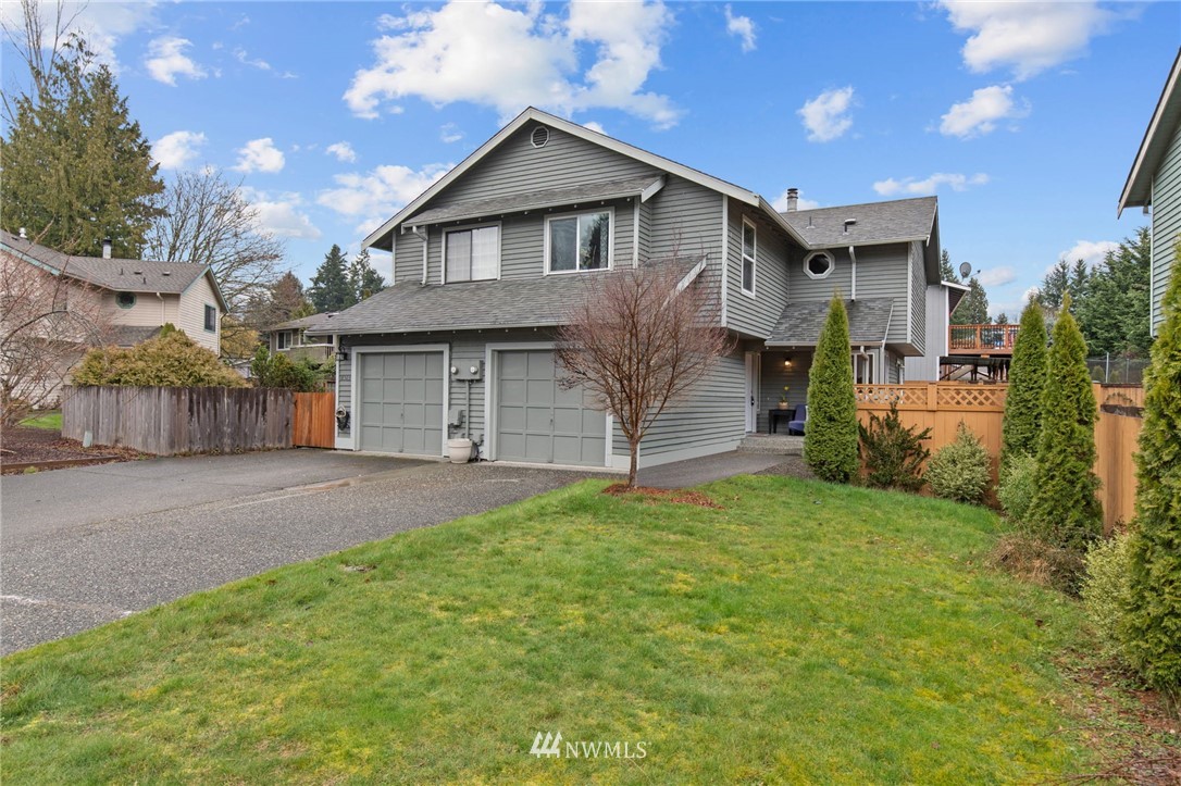 18505 20th Drive Southeast Bothell, WA 98012 - Photo 1 of 35 a front view of a house with a garden and garage