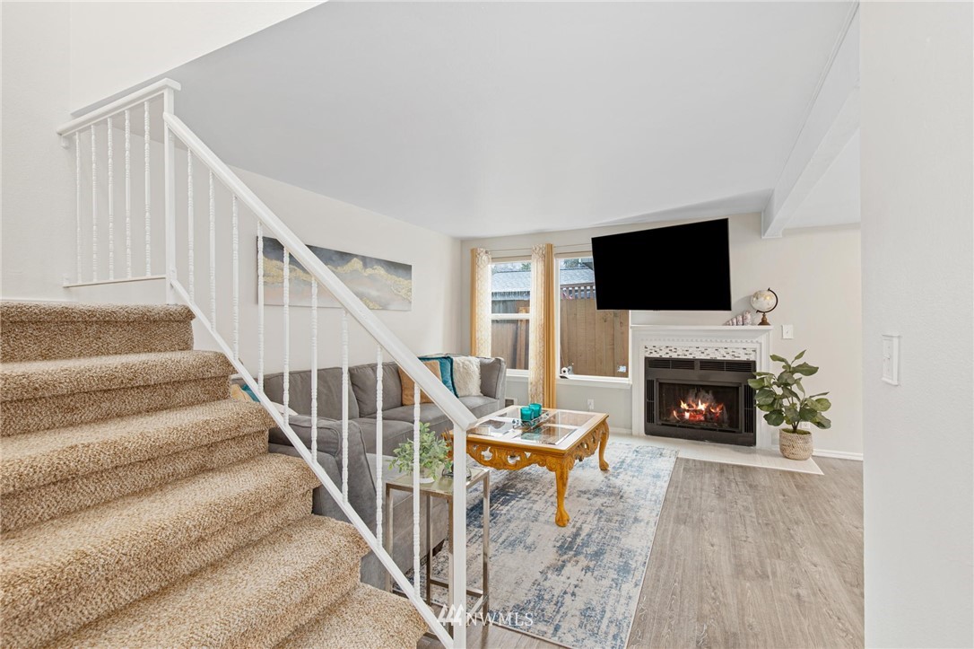 18505 20th Drive Southeast Bothell, WA 98012 - Photo 15 of 35 a view of a livingroom with a fireplace and staircase