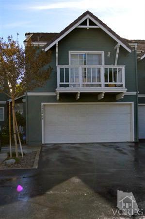 1934 Rory Lane, Unit 4 Simi Valley, CA 93063 - Photo 2 of 15 a front view of a house with a yard