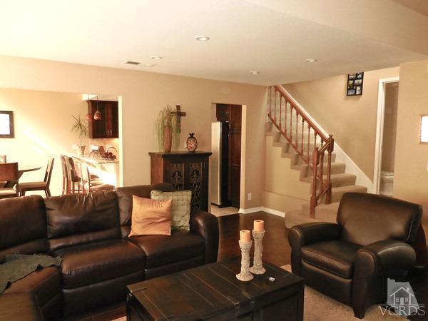 1934 Rory Lane, Unit 4 Simi Valley, CA 93063 - Photo 12 of 15 a living room with furniture and a fireplace