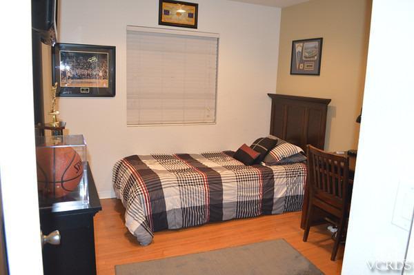 1934 Rory Lane, Unit 4 Simi Valley, CA 93063 - Photo 13 of 15 a bedroom with a bed and cupboard