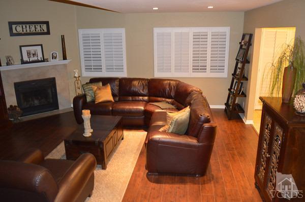 1934 Rory Lane, Unit 4 Simi Valley, CA 93063 - Photo 14 of 15 a living room with furniture a flat screen tv and a fireplace