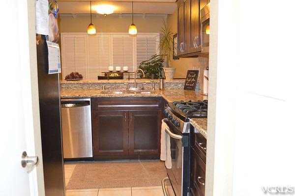 1934 Rory Lane, Unit 4 Simi Valley, CA 93063 - Photo 15 of 15 a kitchen with a sink and a stove top oven