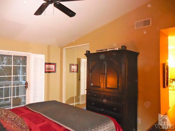 1934 Rory Lane, Unit 4 Simi Valley, CA 93063 - Photo 9 of 15 a bedroom with a bed and cabinets