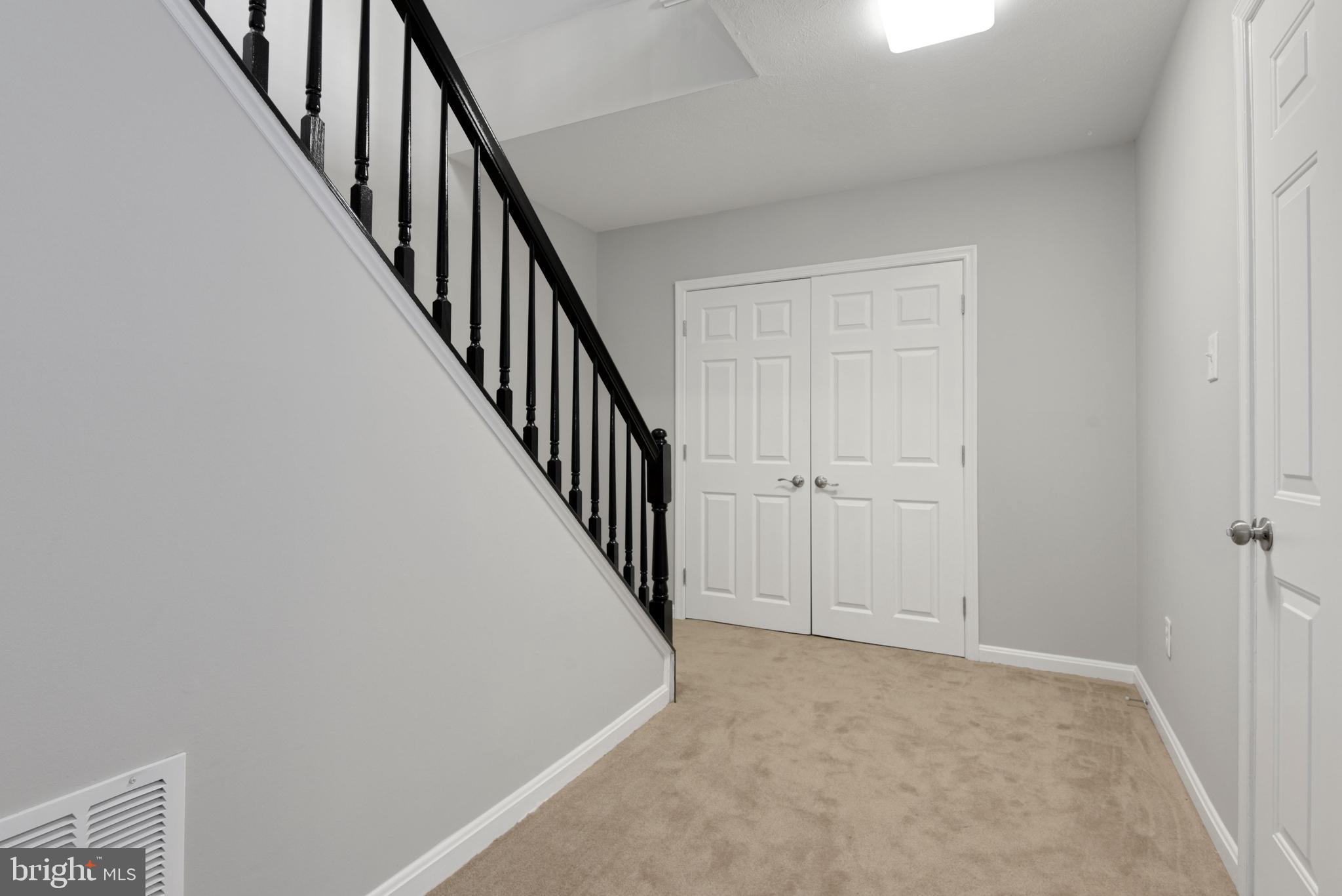 2819 Roesh Way Vienna, VA 22181 - Photo 31 of 64 Lower Level Landing - huge closet below the stairs