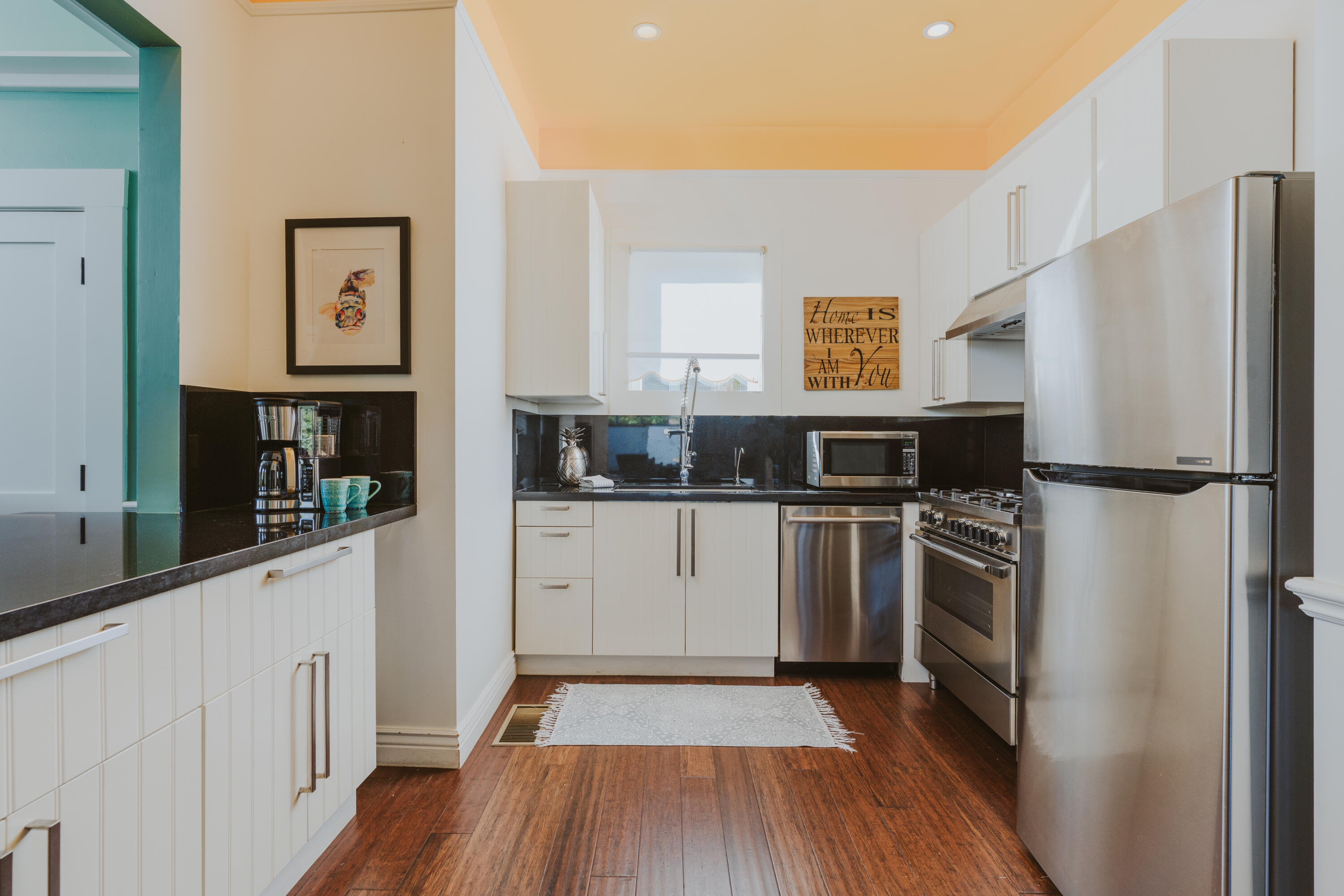 502 Brinkerhoff Avenue Santa Barbara, CA 93101 - Photo 18 of 34 a kitchen with stainless steel appliances a refrigerator sink and microwave