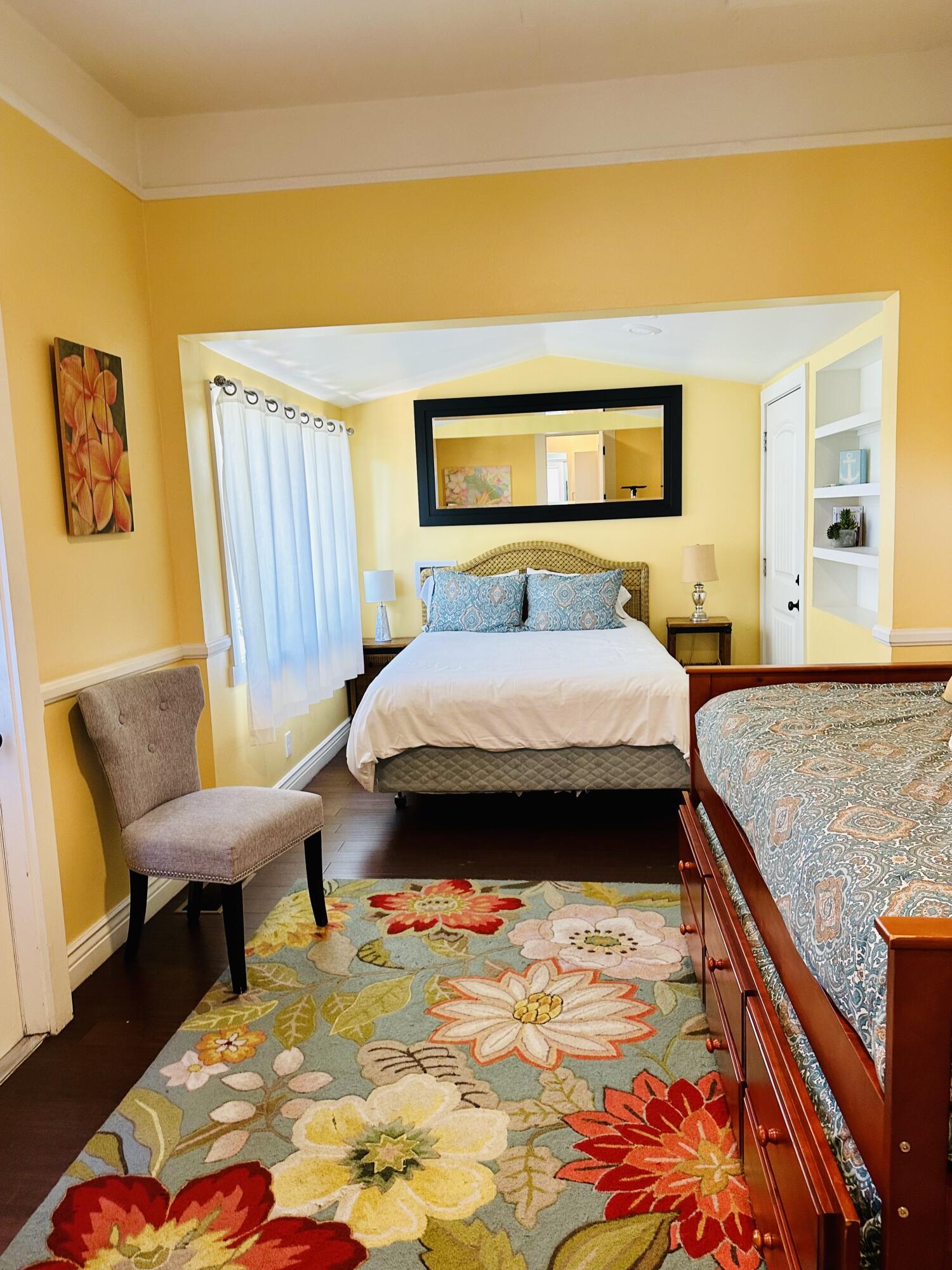 502 Brinkerhoff Avenue Santa Barbara, CA 93101 - Photo 23 of 34 a bedroom with a bed and wooden floor