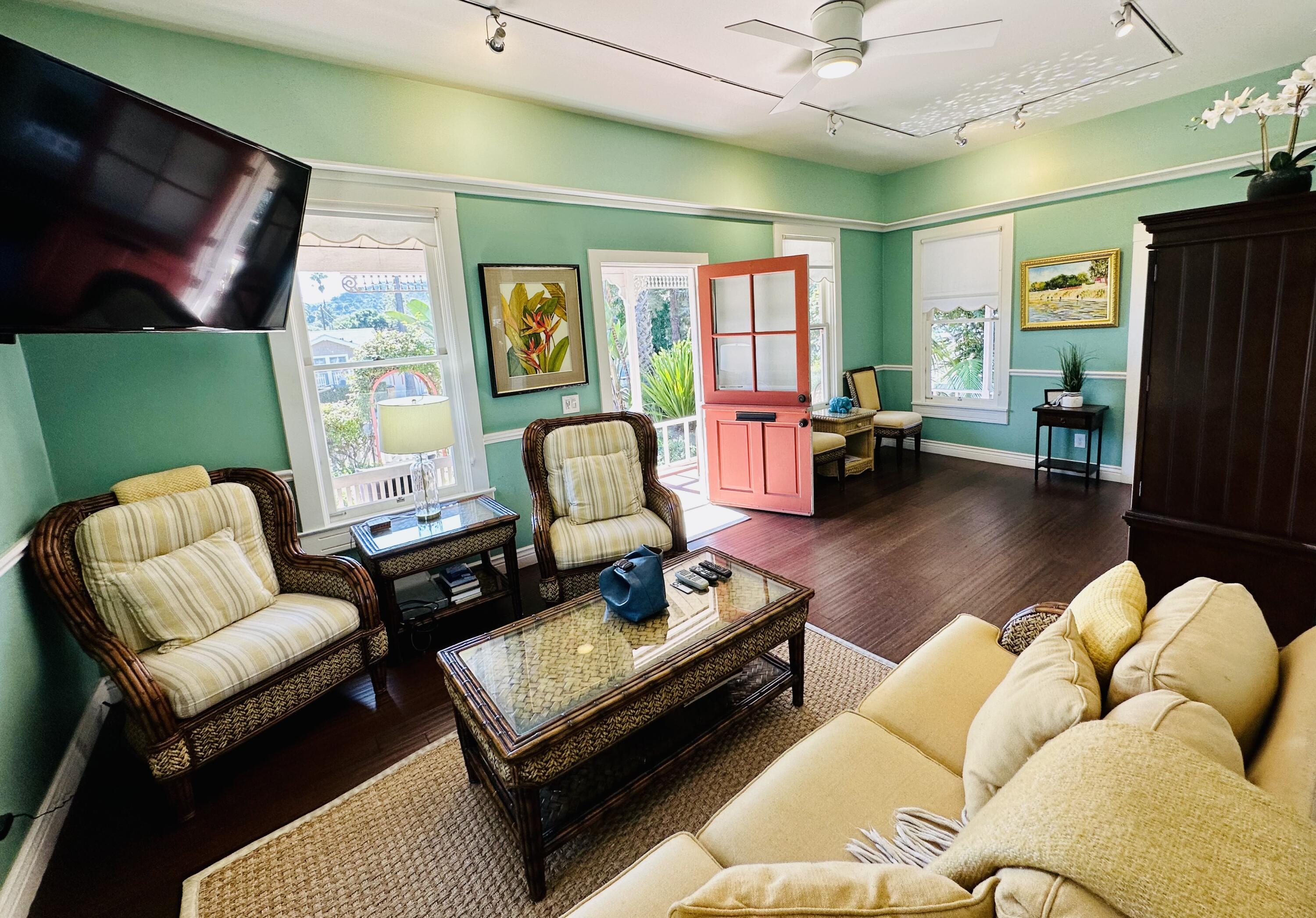 502 Brinkerhoff Avenue Santa Barbara, CA 93101 - Photo 8 of 34 a living room with furniture and a flat screen tv