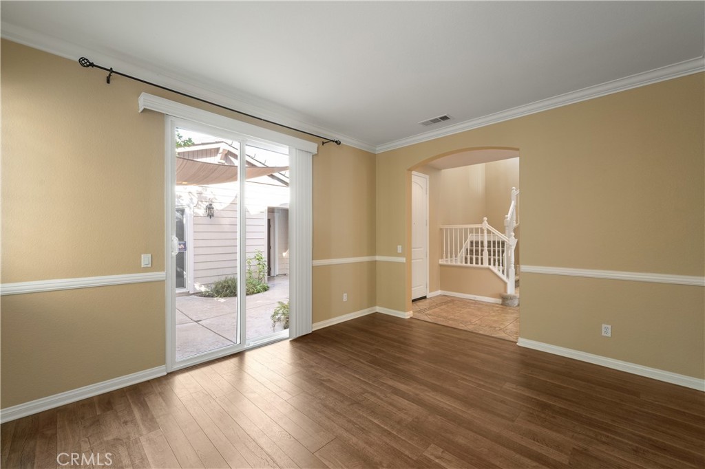 28817 Edenton Way Temecula, CA 92591 - Photo 15 of 56 a view of an empty room with wooden floor and a window