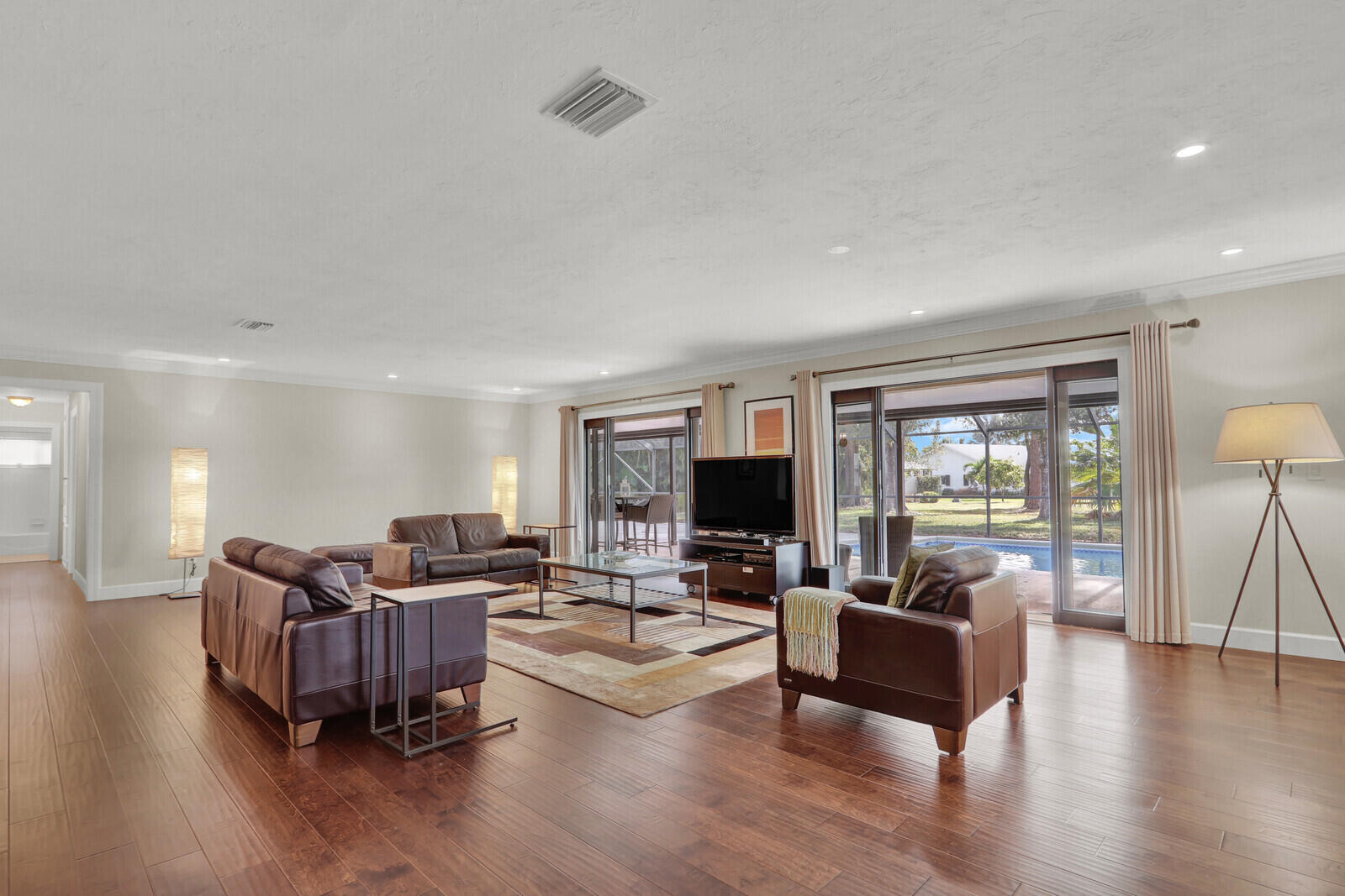 3060 Southeast Darien Road Port St. Lucie, FL 34952 - Photo 14 of 56 a living room with furniture wooden floor and a flat screen tv