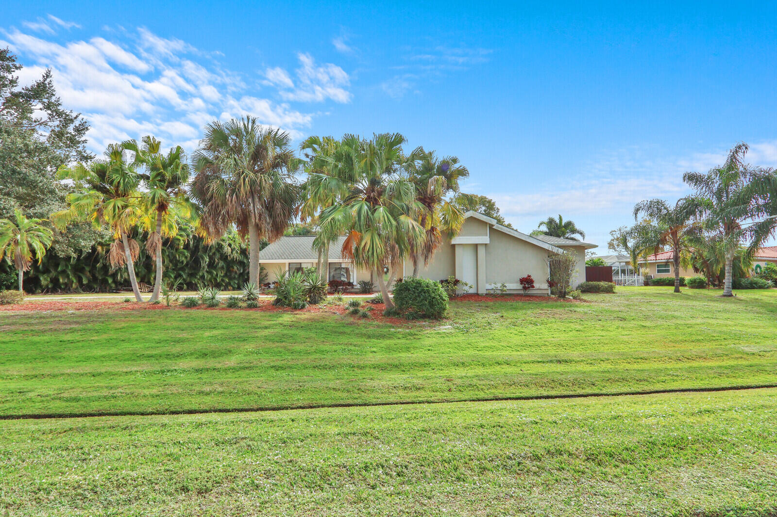 3060 Southeast Darien Road Port St. Lucie, FL 34952 - Photo 3 of 56 a front view of a house with a yard