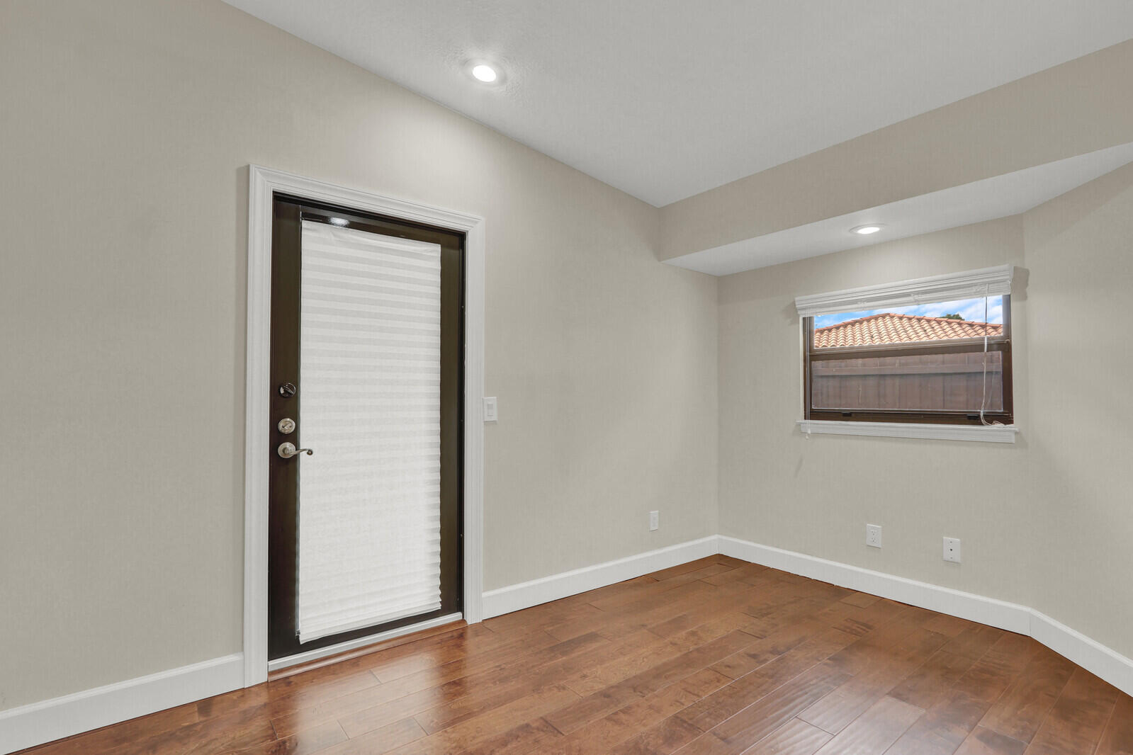 3060 Southeast Darien Road Port St. Lucie, FL 34952 - Photo 33 of 56 an empty room with wooden floor and windows