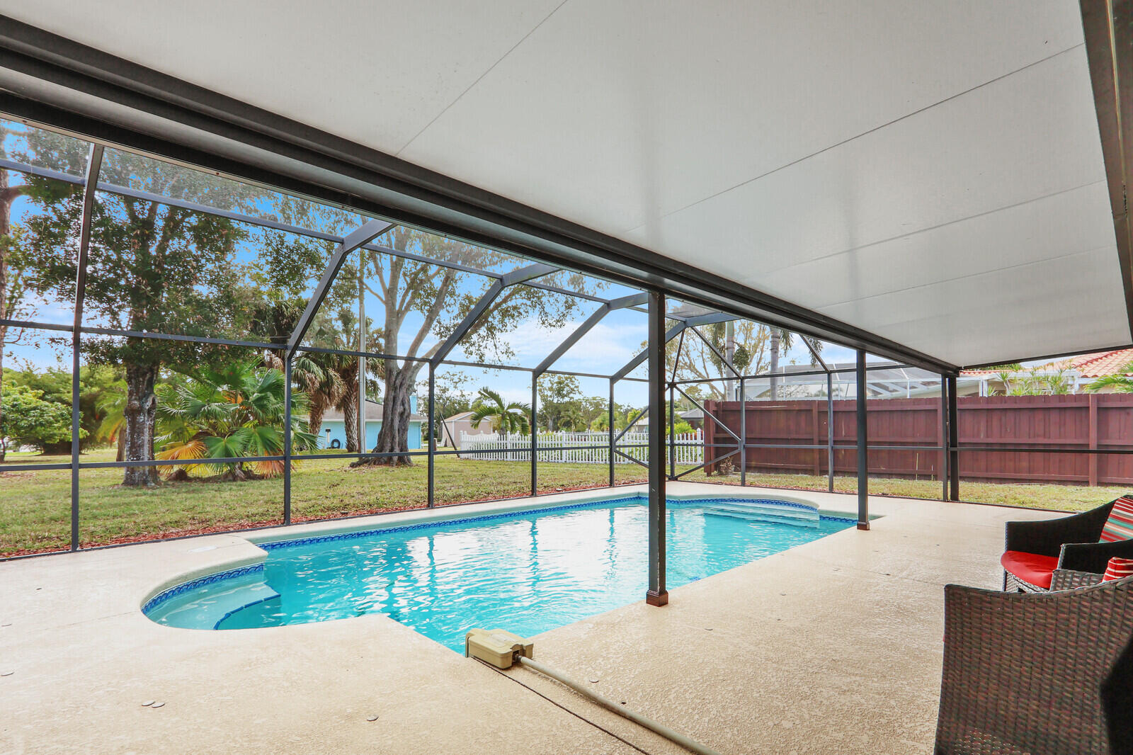 3060 Southeast Darien Road Port St. Lucie, FL 34952 - Photo 37 of 56 a view of a swimming pool with a patio