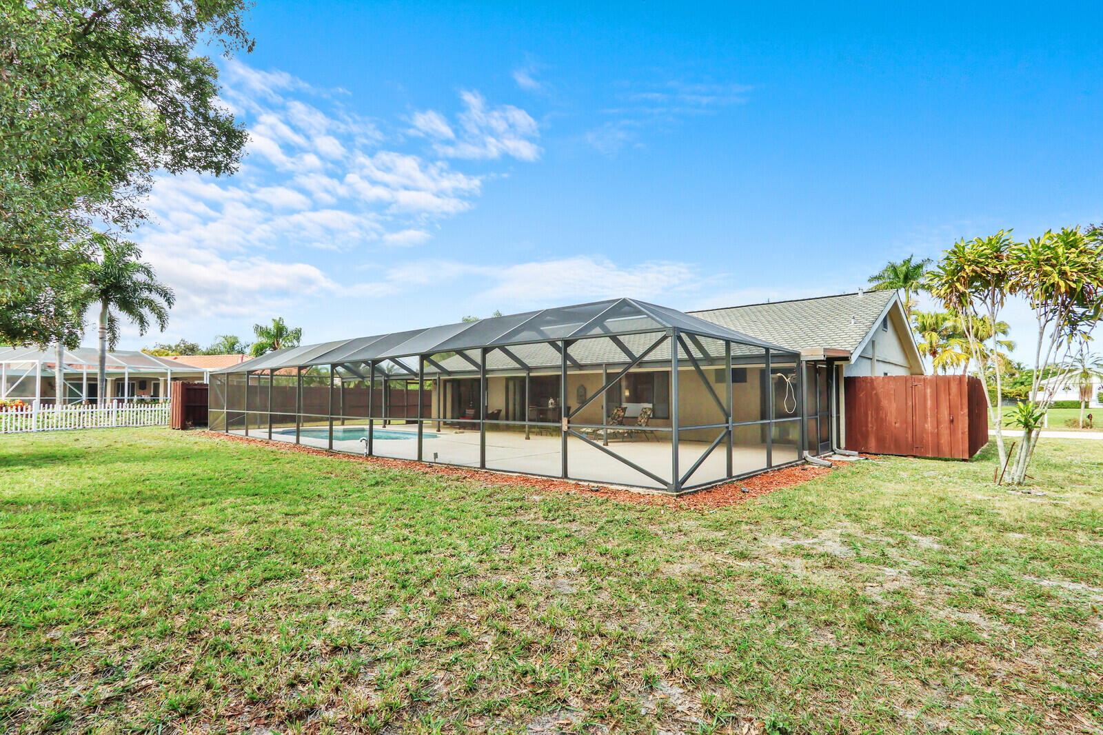 3060 Southeast Darien Road Port St. Lucie, FL 34952 - Photo 38 of 56 Backyard with Screened Pool