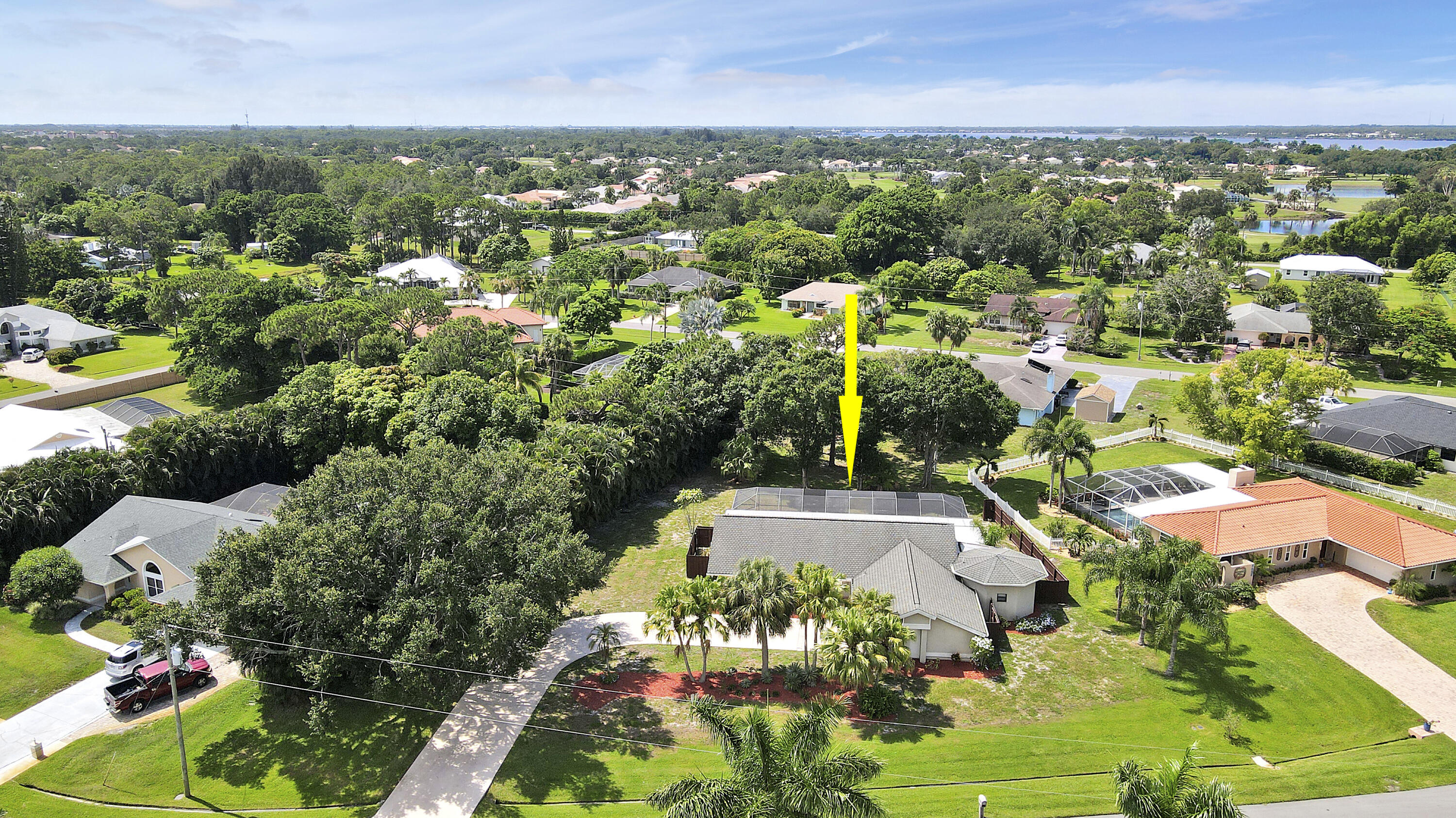 3060 Southeast Darien Road Port St. Lucie, FL 34952 - Photo 41 of 56 an aerial view of residential houses with outdoor space and trees